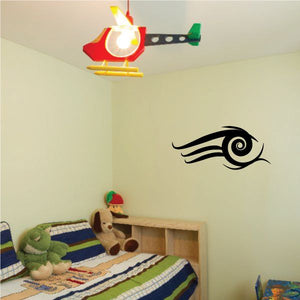 Tribal vinyl wall decal with black eye-like swirl design, pinstripe style