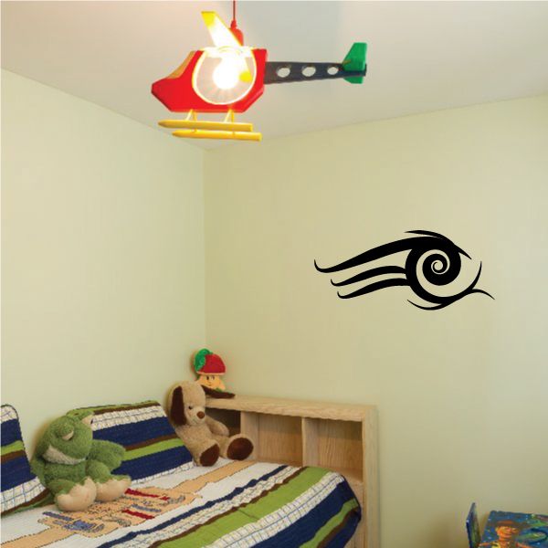 Tribal vinyl wall decal with black eye-like swirl design, pinstripe style