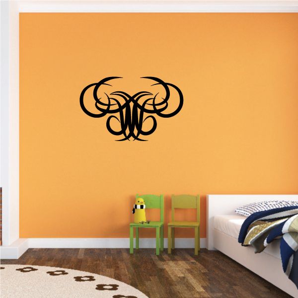 Tribal pinstripe wall decal featuring black swirled emblem on wall