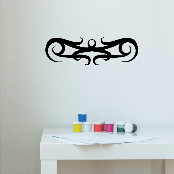 Black tribal scroll wall decal with central curls