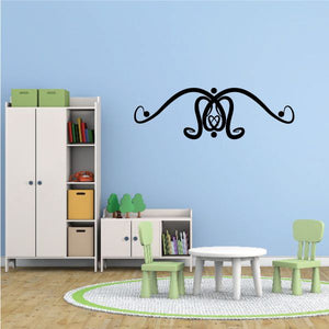 Tribal-style wall decal featuring a black arched emblem with swirl accents