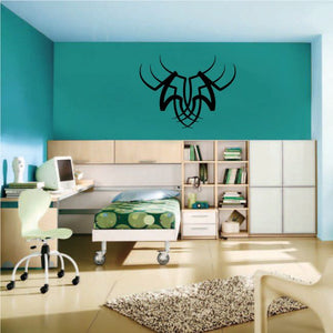 Tribal pinstripe wall decal featuring a black stylized horned face