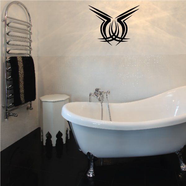 Tribal pinstripe vinyl wall decal with black emblem above a bathtub