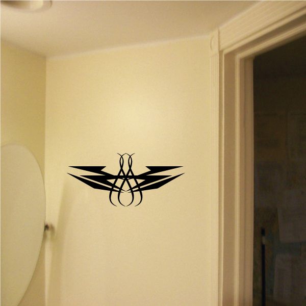 Tribal pinstripe wall decal in black with wing shapes and central emblem