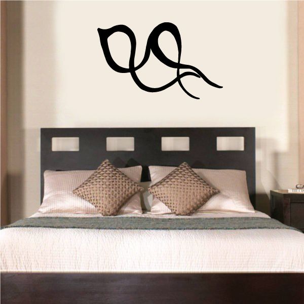 Black tribal wall decal with pinstripe curls