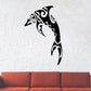 Tribal dolphin leap decal in black with Polynesian-style geometric patterns
