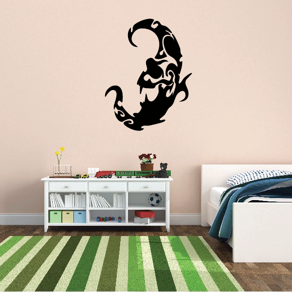 Tribal swirl moon decal, black graphic of a curled owl-like face in a crescent