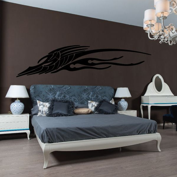 Tribal vehicle pinstripe vinyl decal, black winged motif on wall
