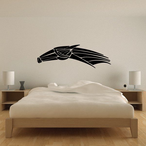 Tribal vehicle pinstripe vinyl decal, black line-art design on wall