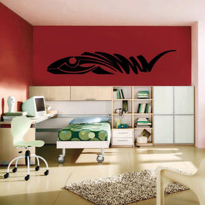 Black tribal vehicle pinstripe wall decal with swooping lines on red wall