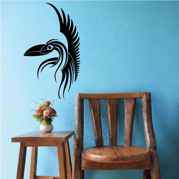 Tribal bird head vinyl decal in black with pinstripe feathered lines.