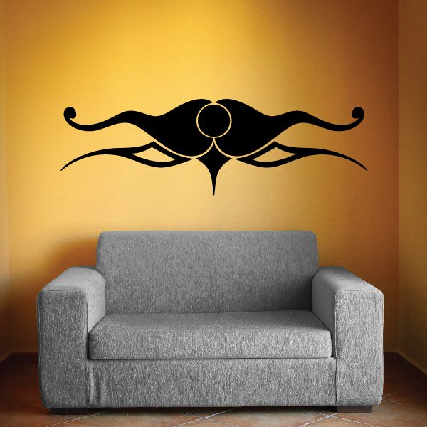 Tribal wall decal vinyl graphic with symmetrical swirls and central emblem, black