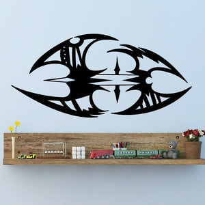 Black tribal vehicle pinstripe wall decal with angular emblem and compass-style center