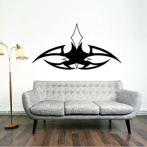 Black tribal vehicle pinstripe wall decal vinyl, centered emblem above sofa.