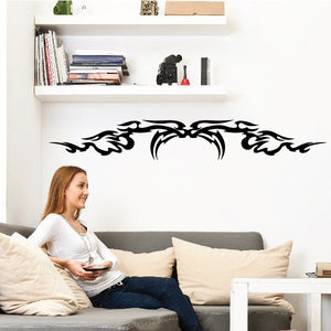 Tribal vehicle pinstripe wall decal, black decorative graphic on wall.