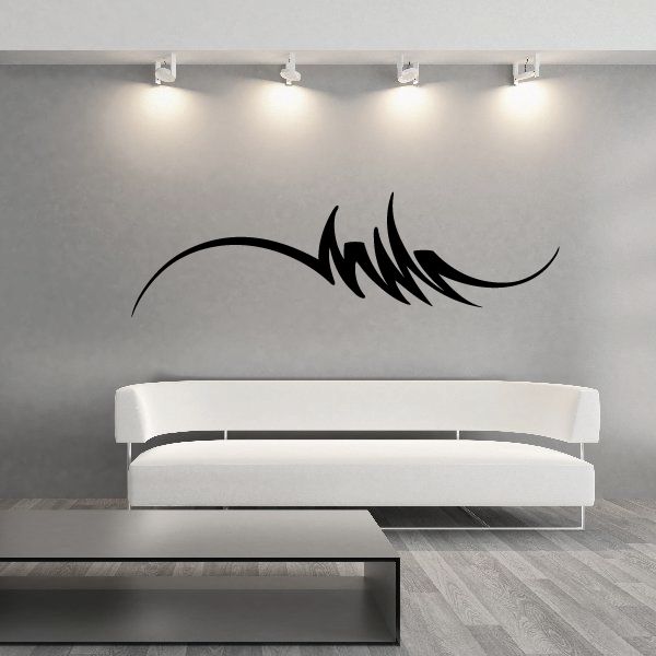 Black tribal pinstripe wall decal with sweeping flame-like shape above furniture