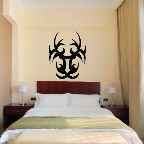 Tribal wall vinyl decal with black horned biohazard-style symbol