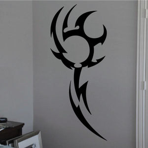 Black tribal vinyl wall decal with tribal emblem and sweeping lines