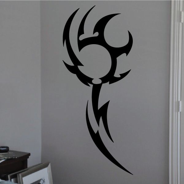 Black tribal vinyl wall decal with tribal emblem and sweeping lines