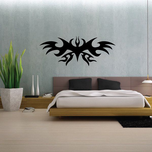Black tribal wall decal with flame-like center and sweeping wing shapes
