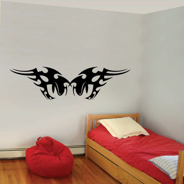 Tribal vinyl wall decal with bold black winged design