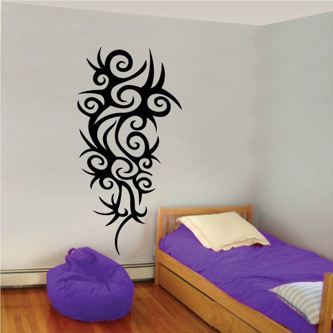 Black tribal wall decal with ornate vertical design and swirling shapes