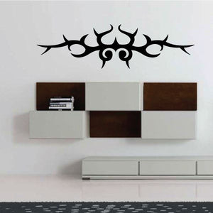 Tribal vinyl wall decal, black spiked emblem with two circular eyes and crescent tips