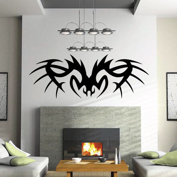 Tribal vinyl wall decal with bold black flame-like design on wall
