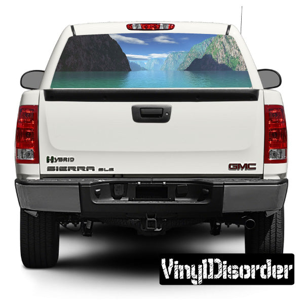 Vehicle rear window view graphic decal with mountain and water scene