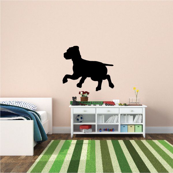 Trotting puppy decal with black dog silhouette standing and trotting.