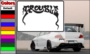 Trouble decal on white background with black stylized lettering, rectangular shape
