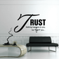 Black wall decal with cursive J, 'RUST' text, and 'Nothing happens to you' message.