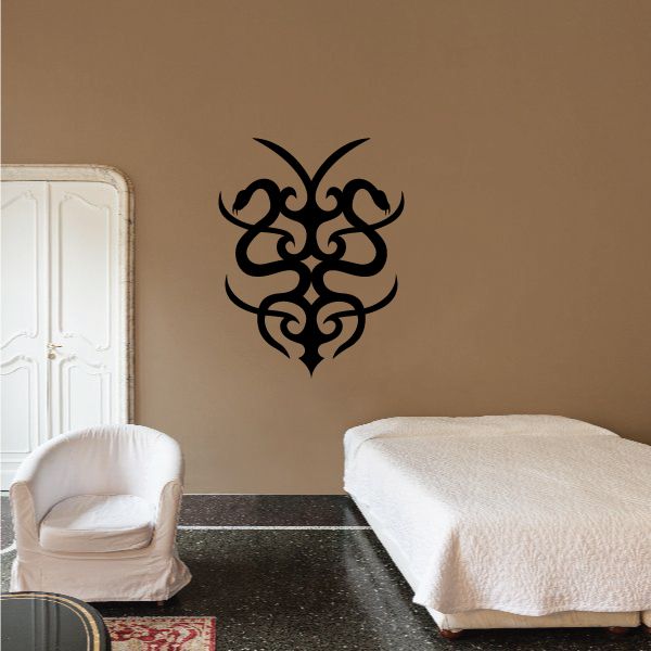 Tribal two-snake wall decal in black with ornate symmetrical vine pattern