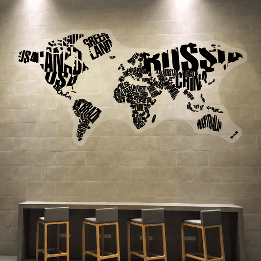 Close-up view of a typographic world map wall decal highlighting the country name