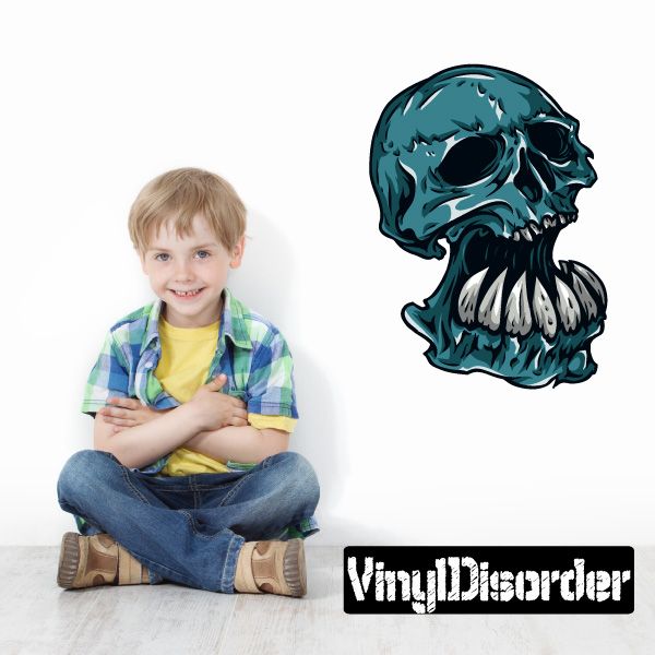 Teal underbite skull decal sticker with jagged teeth, black outline