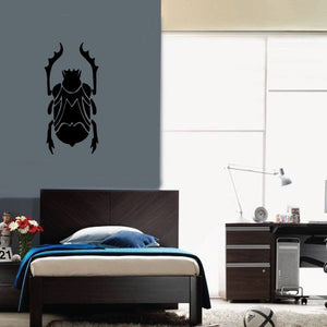 Black beetle wall decal with upward arms silhouette