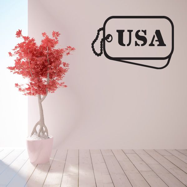 USA dog tag decal with black outline and white center reading USA