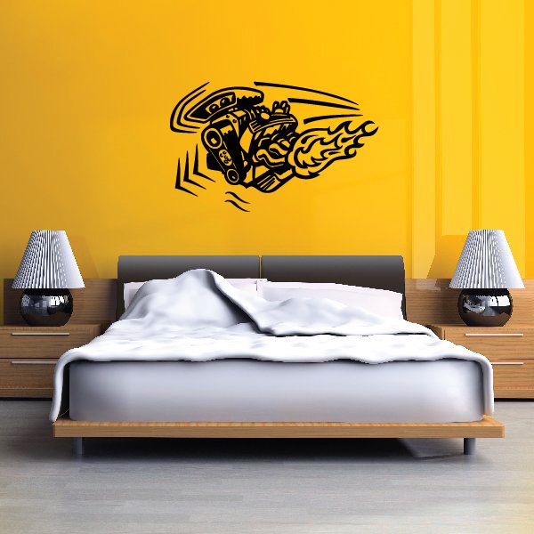 Black racing motor decal sticker with flames on a yellow wall