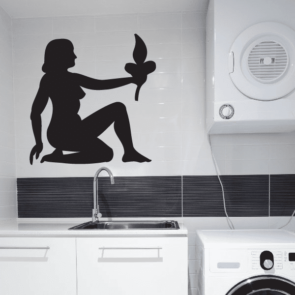 Seated silhouette figure wall decal, holding a small flame-like shape.
