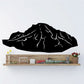Black volcano mountain wall decal with lighter crack lines across the summit
