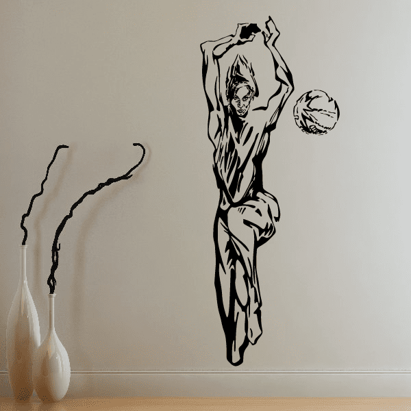 Volleyball wall decal of a black player silhouette with a raised arm holding a ball