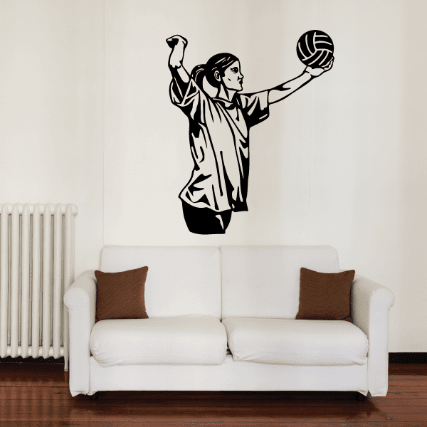 Volleyball wall decal of a person serving with a ball, black vinyl
