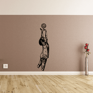 Volleyball wall decal of a player reaching up to spike a ball, black vinyl