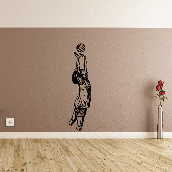 Volleyball wall decal of a player reaching up to spike a ball, black vinyl