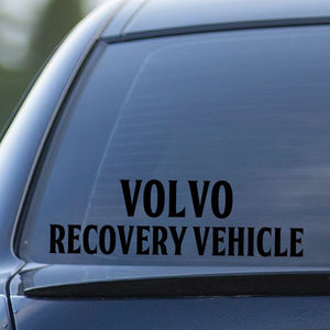 Volvo recovery vehicle decal with black lettering on a car window