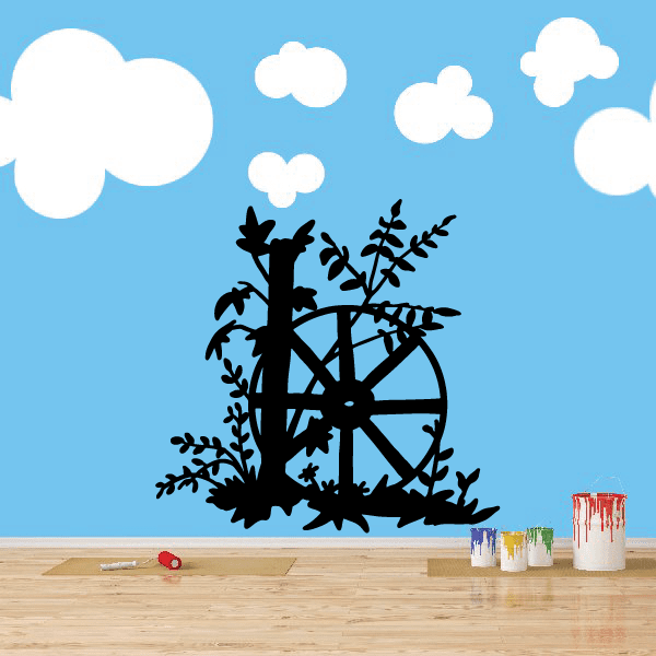 Black wagon wheel wall decal with foliage and branches silhouette
