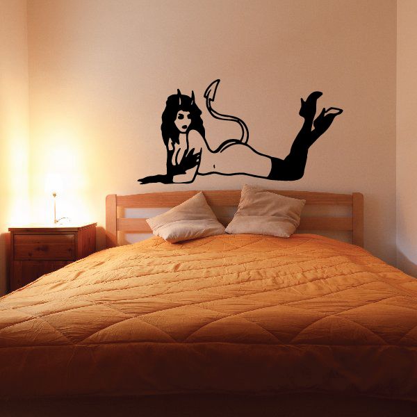 Devil girl wall decal, black silhouette of seated character with tail and horns