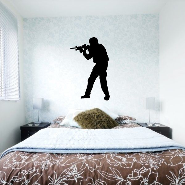 Image of Walking Soldier Aiming Rifle Decal