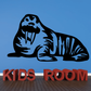 Walrus staring decal with “KIDS ROOM” block lettering