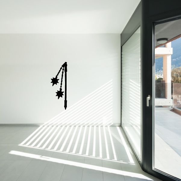 War flail decal with black chain-and-mace weapon icon on wall